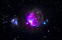 a purple and blue nebula with a star in the middle