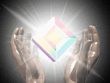 a pair of hands holding a glowing cube in their hands