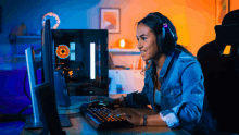 a woman wearing headphones is playing a video game