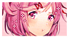 a close up of a pink haired anime girl 's face on a postage stamp .