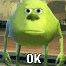 mike wazowski from monsters inc is standing on a wooden floor with his eyes closed and says `` ok '' .