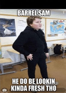 a young boy is standing in a classroom with his hands on his hips and a meme .