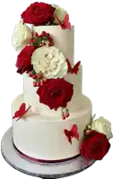 a white wedding cake with red roses and butterflies on it