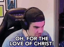 a man wearing headphones is sitting in a chair and saying `` oh , for the love of christ '' .