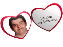 a heart shaped mirror with a picture of a man and the words " bendel my beloved " on it