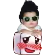 a baby wearing sunglasses is sitting on a marshmallow with a face on it .