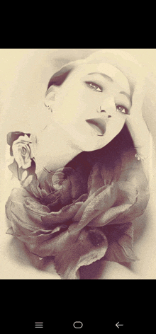 a black and white photo of a woman with a rose in her hand