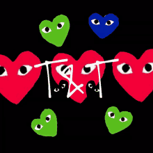 a drawing of hearts with eyes and the letters t and t