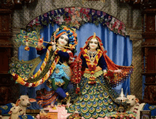 a statue of radha and krishna in a temple with a sign that says ' krishna ' on it