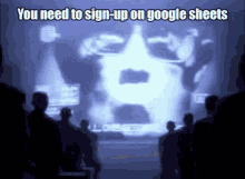 a group of people standing in front of a screen that says you need to sign up on google sheets