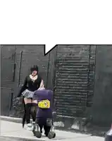 a man with a yellow bag on his back is kneeling down next to a woman on the sidewalk