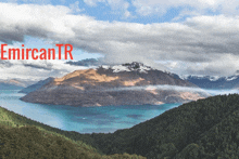 a picture of a lake with mountains in the background and the words emircantr in red