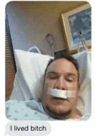 a man is laying in a hospital bed with a bandage on his mouth and the text i lived bitch