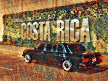 a painting of a car in front of a costa rica sign