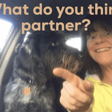 a woman sitting in a car with a dog and the words what do you think partner