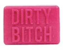 a pink bar of soap with the words dirty bitch written on it