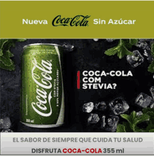 a green can of coca-cola sits on ice