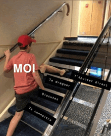 a boy in a red shirt is walking up a set of stairs with the word moi on the bottom