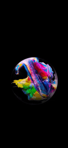 a soap bubble with a rainbow of colors inside of it