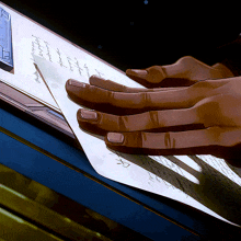 a close up of a person 's hands holding a piece of paper that says ' i love you ' on it