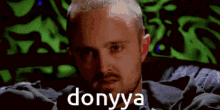 a man with a beard and the word donyya on his face