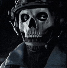 a black and white photo of a person with a skull mask on