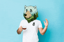 a man with a bear head is holding a cup of tea