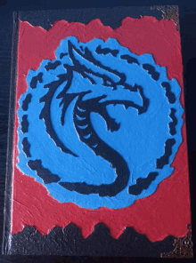 a book with a blue and black dragon on it