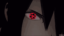 a close up of a person 's eye with a red pupil and a star in it .