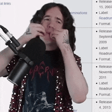 a man playing a harmonica in front of a microphone with a wikipedia page in the background