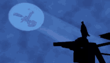 a silhouette of a batman standing on top of a building with a dragon flying in the background