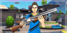 a woman in a blue shirt is holding a shotgun in front of a house .