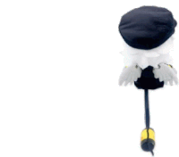 a stuffed animal with wings and a black hat is sitting on a stick .