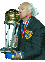 a man in a cabj jacket kisses the trophy