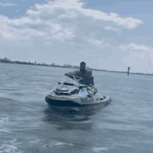 a man is riding a jet ski on the water