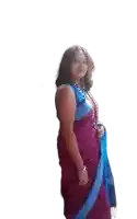 a woman in a purple and blue saree is smiling