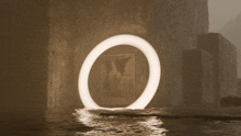 a circle in the middle of a dark room with water coming out of it