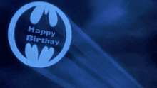 a blue batman logo with the words happy birthday on it