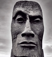 a close up of a statue of a man 's face with his eyes closed