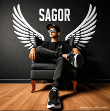 a boy sitting in a chair with wings and the name sagor