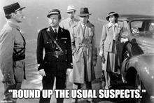 a black and white photo of a group of people with the caption round up the usual suspects