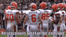 a group of cleveland browns football players standing on the field with the caption reservations for 11 in the end zone