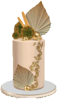 a white cake with gold decorations on top of it