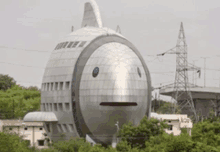 a building that looks like a fish with a big face