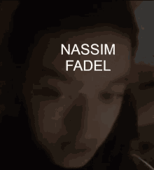 a close up of a person 's face with the name nassim fadel on the top