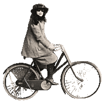 a woman in a hat and sunglasses is riding a bicycle