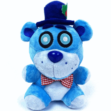 a blue teddy bear is wearing a top hat and bow tie