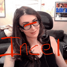 a woman wearing glasses has the word incel written in red on her face