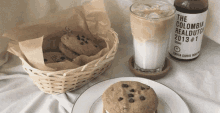 a basket of cookies sits next to a glass of milk and a bottle of the colombia realdutch 2013 # 1