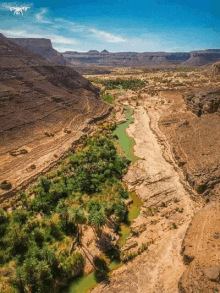 an aerial view of a river running through a desert landscape